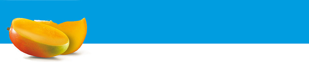 A mango sliced in half, revealing its vibrant yellow flesh and red skin, rests against a plain blue background.