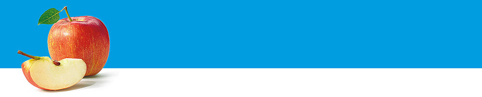 An apple with a leaf and a slice of apple on a white surface against a blue background.