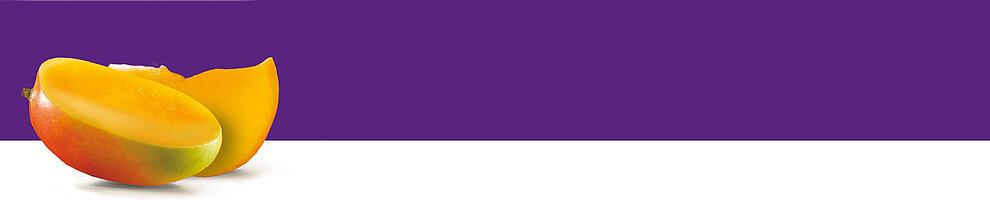 A ripe mango sliced in half, revealing its juicy yellow flesh and red skin, rests against a purple background.