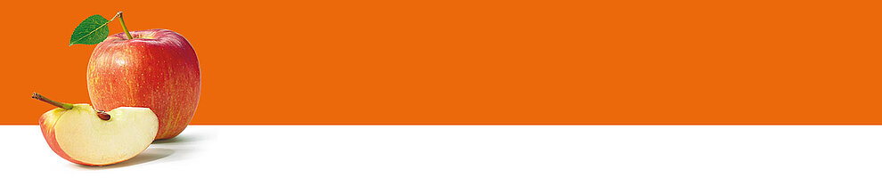 An apple with a leaf and a slice of apple on a white surface against an orange background.