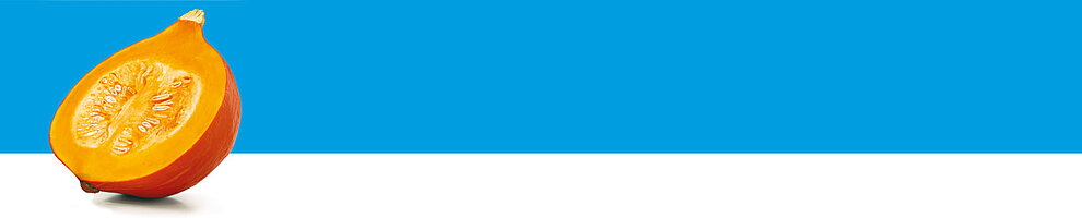 A halved pumpkin with seeds is presented against a blue background.