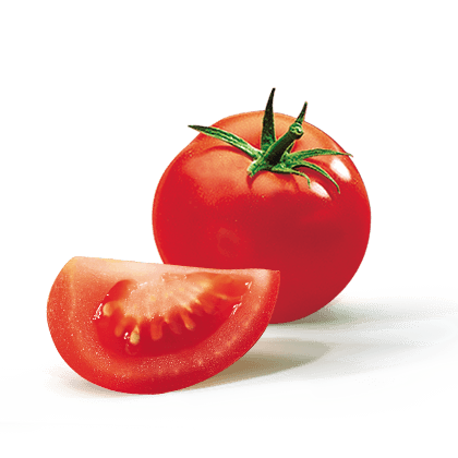 A whole tomato and the slice of a second one