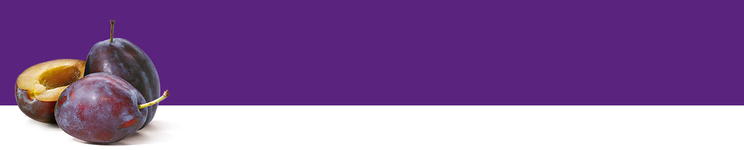 Three plums, one cut in half, are displayed against a purple background.