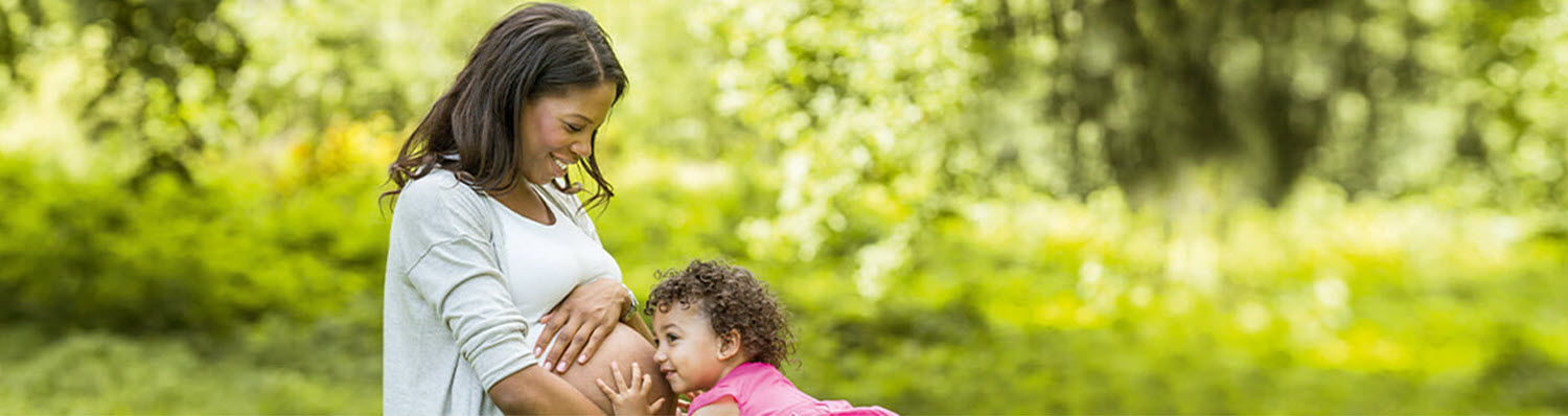 A woman and a child outdoors.