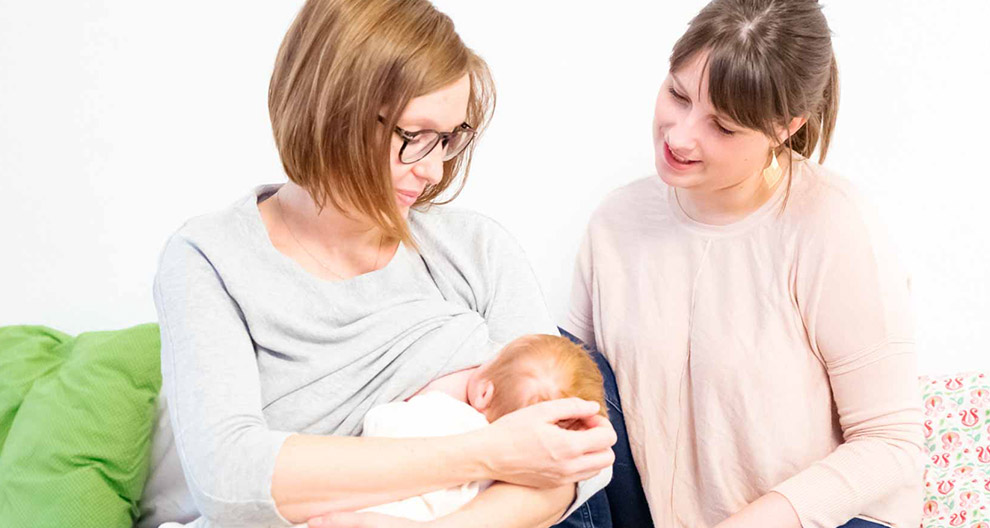 Two women and a baby.