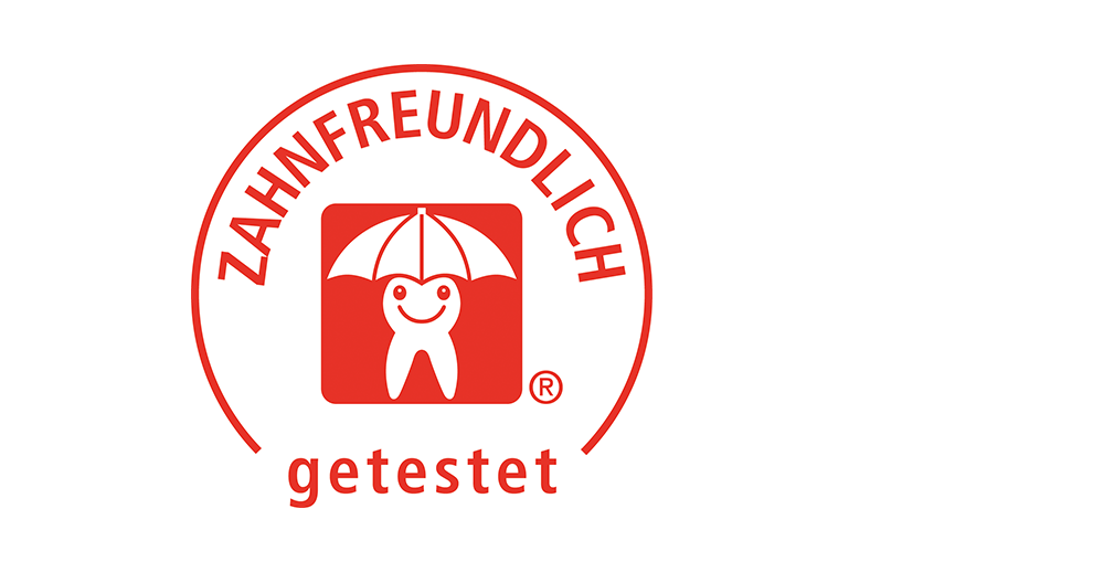 A red and white circular logo with a smiling tooth character under an umbrella, accompanied by the text "ZAHRFREUNDLICH" and "getestet".