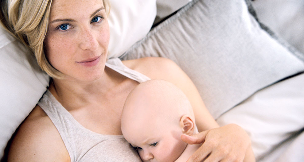 A woman with a baby.